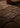Dark brown hand-tufted geometric wool rug with a soft plush texture