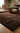 Chocolate brown wool rug for a living room or bedroom